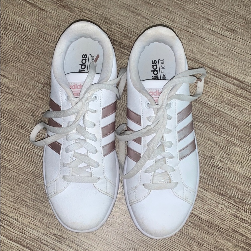 Slightly worn rose gold Adidas all-stars